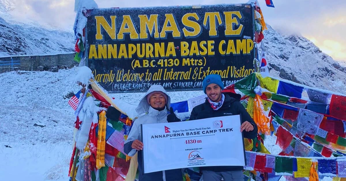 Standing at Annapurna Base Camp holding Everest Thrill's Banner